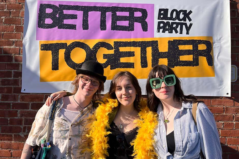 MCLA "Better Together" block party three friends with arms around each other