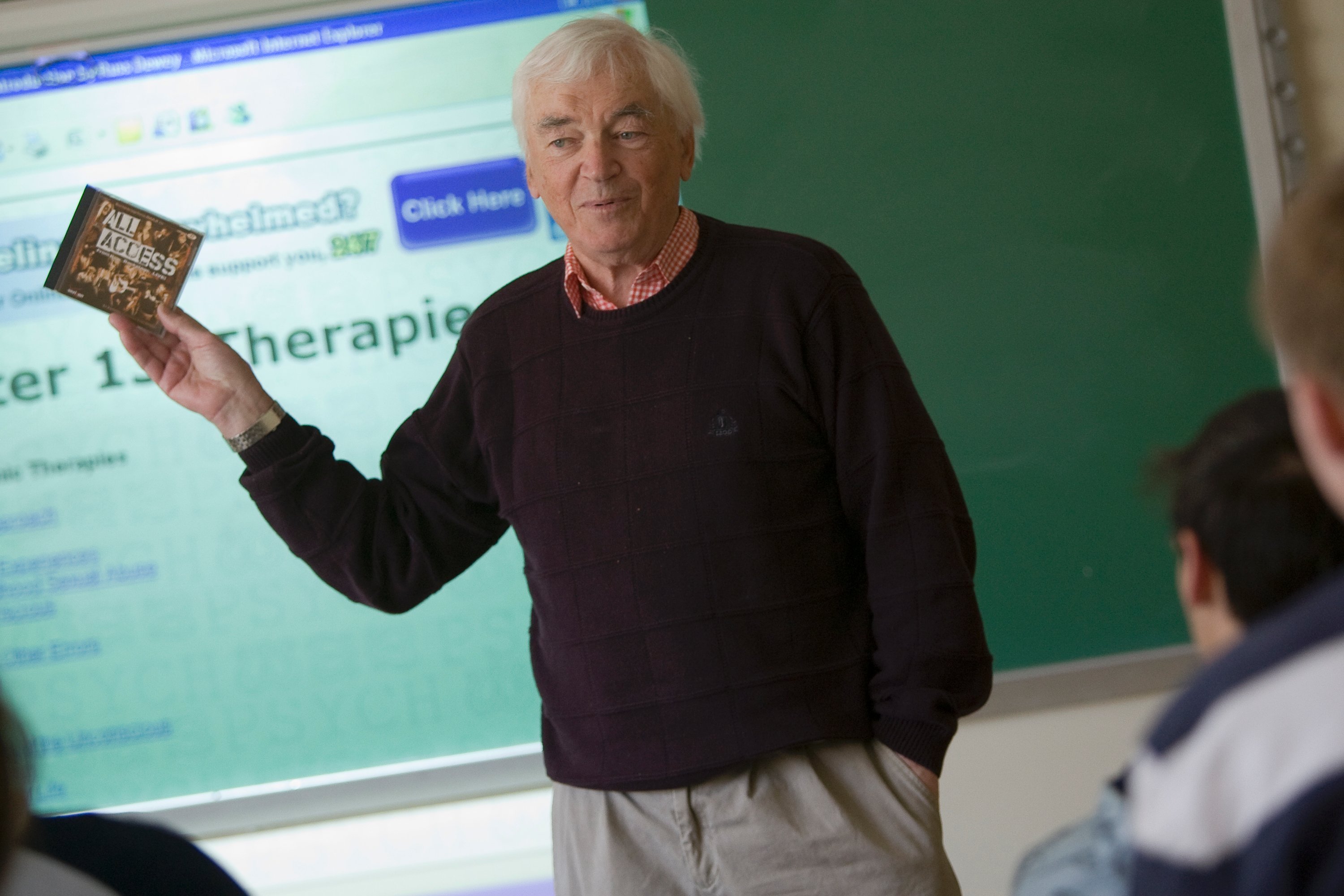 Professor in front of a projector