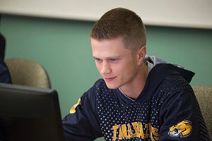 Student working on his computer