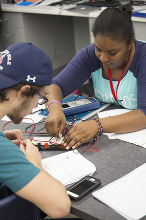 Students working on a circuit board