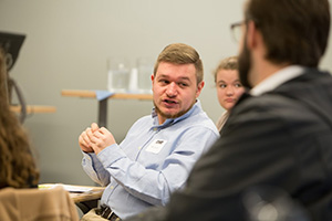 students speaking in class