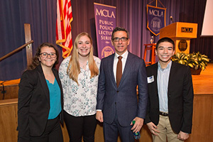 three students standing with Clint Watts