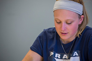 student working on her paper