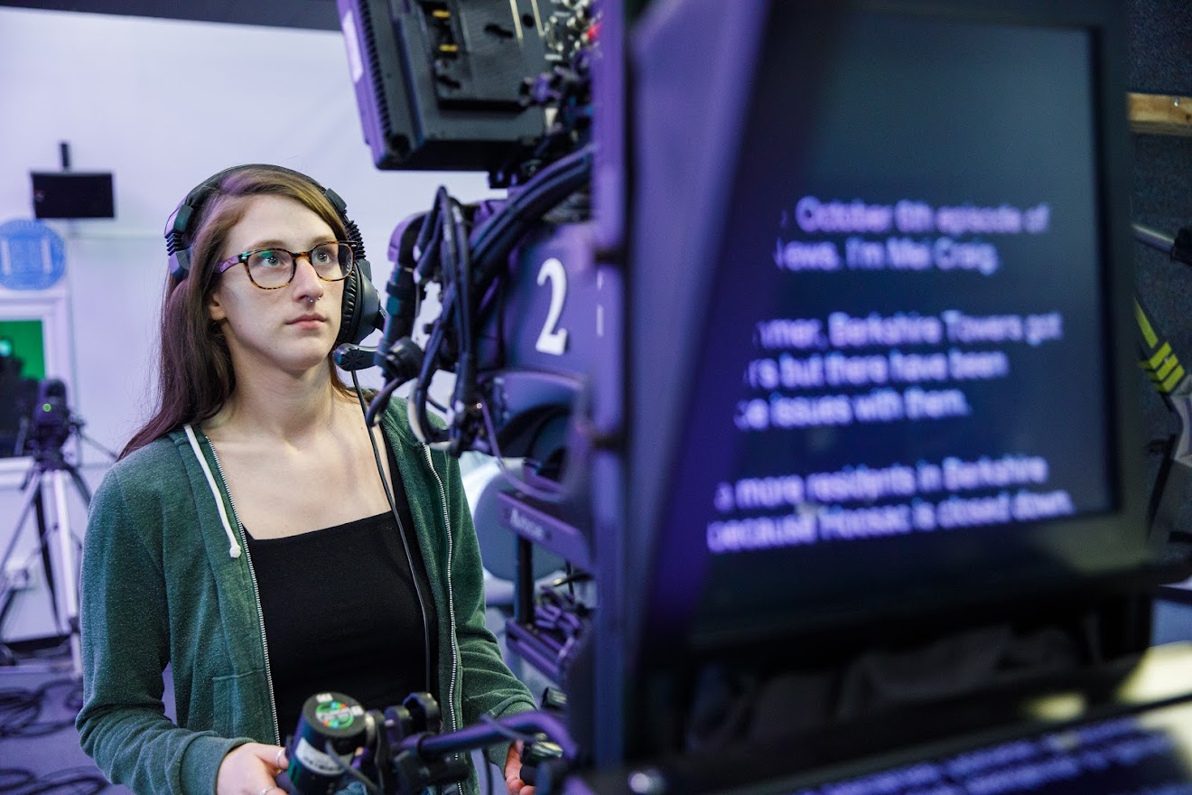 Student operating a television camera