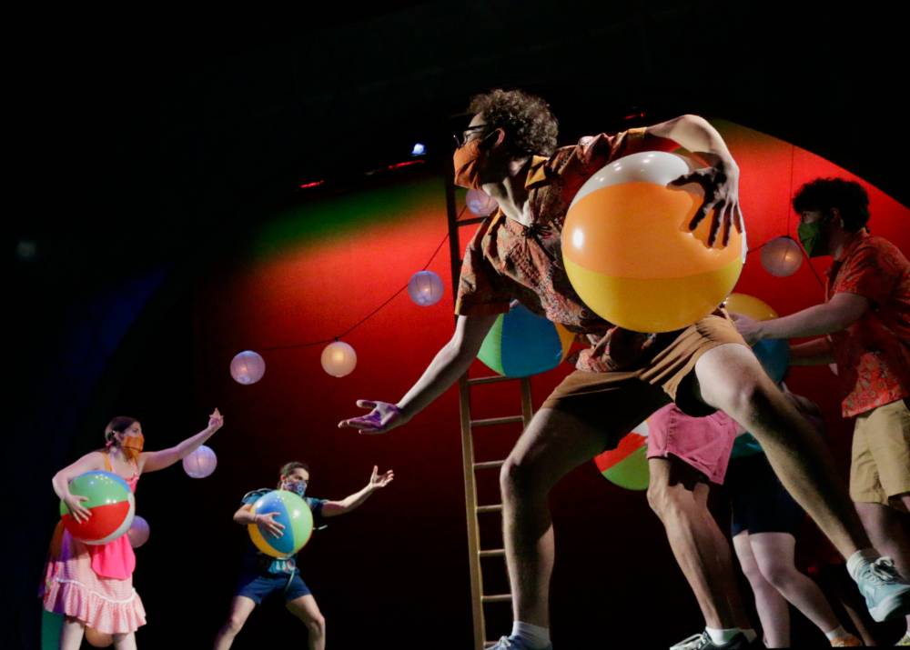 Actors holding beachballs