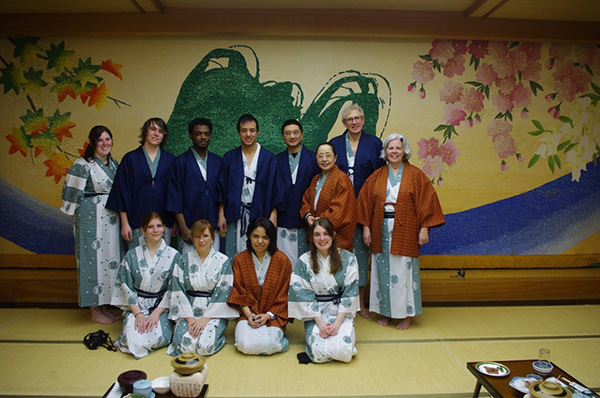 Professor and students dressed for a Japanese banquet
