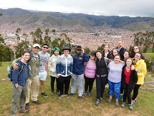 Student and faculty above Cuzco