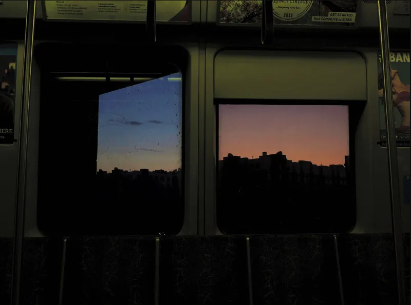 Reflection of dusk in a subway car window