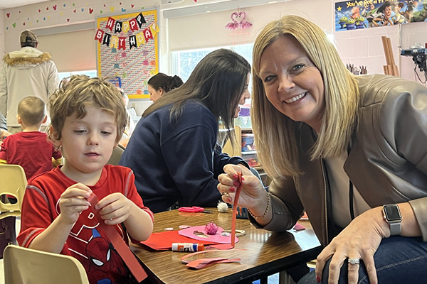 MCLA's Heidi Allen with a child