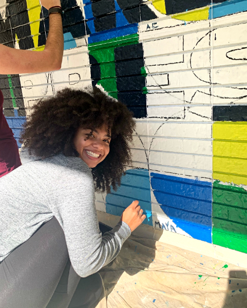 Maya McFadden at her community mural