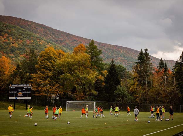 MCLA soccer field with students playing