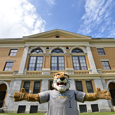 MCLA Mascot in front of Murdock Hall