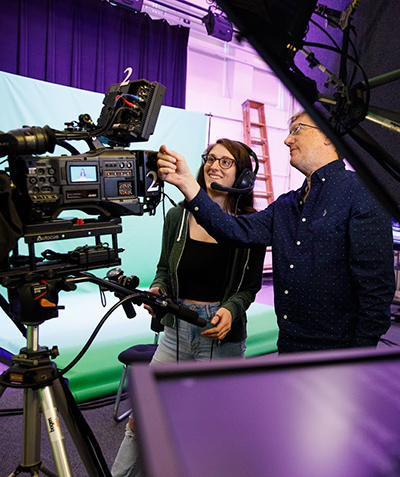 Instructor demonstrating camera for student