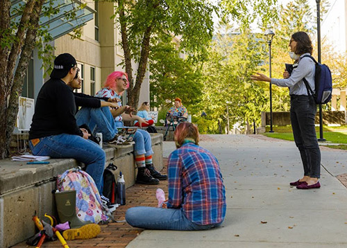 Student hanging out on the quad