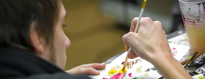 Student making a painting